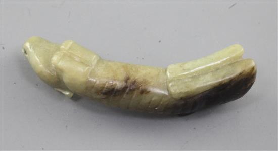 A Chinese yellow and black jade carving of a dog, Song dynasty or later, length 6cm